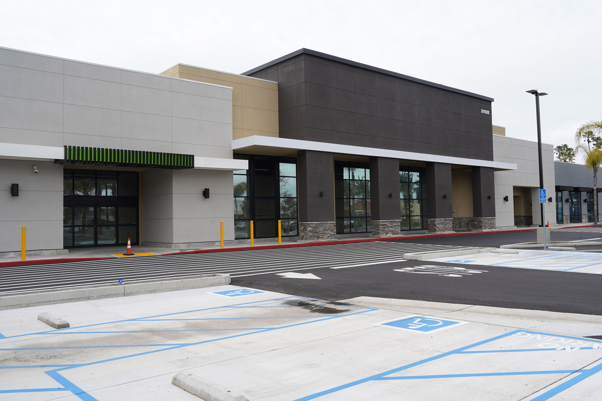 empty parking lot in the daylight with a modern building